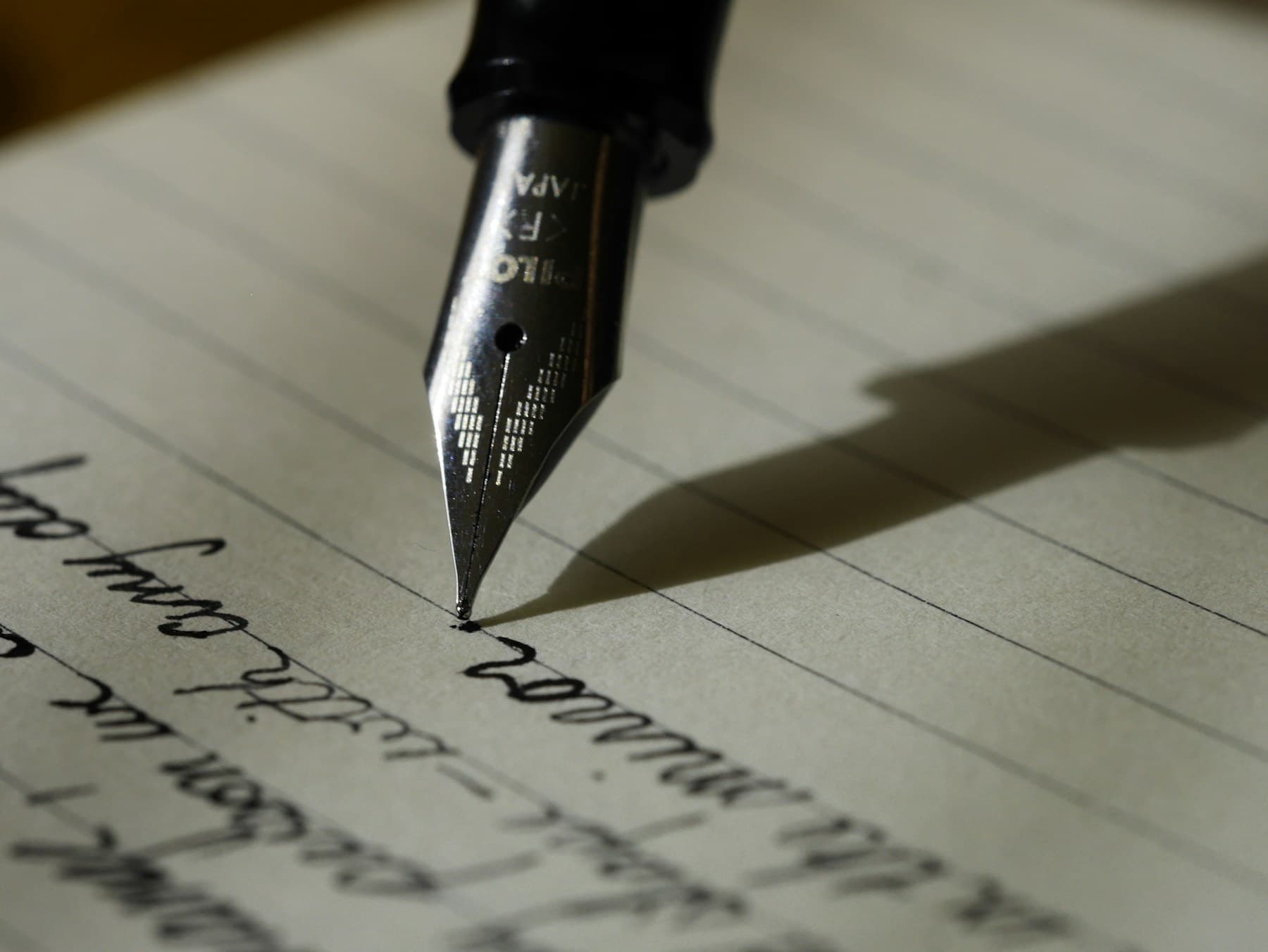A notebook and pen on a desk